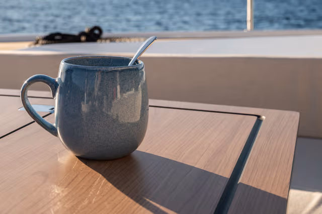 9_Blue_coffee_cup_placed_on_outdoor_table_2966f1b3c0